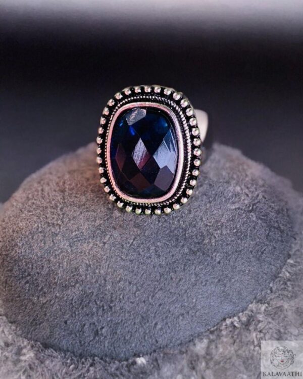 Minimalist silver adjustable ring with blue center stone