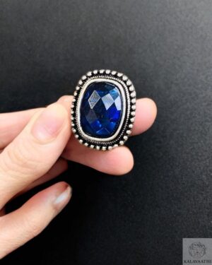 Blue rectangular stone ring with adjustable silver-toned band