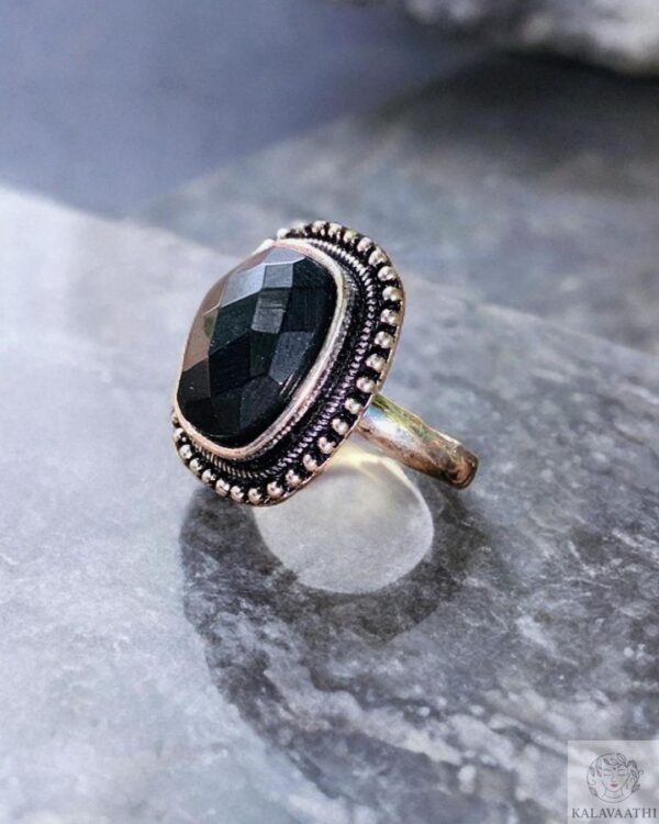 Minimal oxidised ring in black tone with textured design