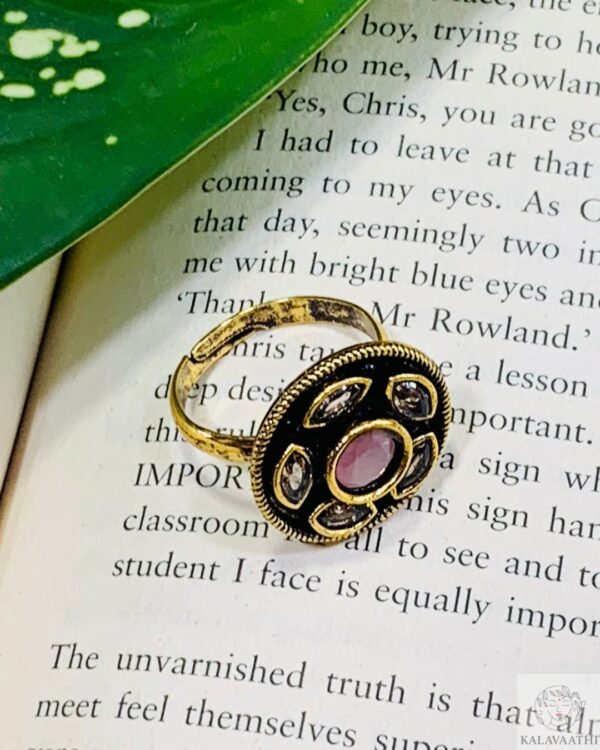 Statement ring with pink center stone and Kundan detailing.
