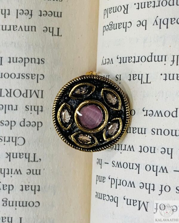 Pink Kundan ring with white stones and adjustable gold band.