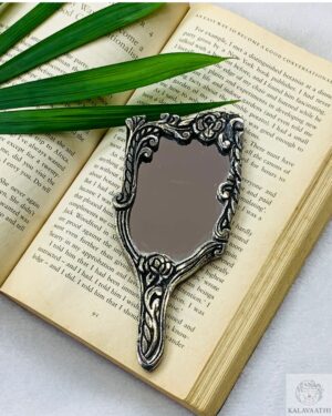 A perfect blend of tradition and elegance, this silver mixed oxidised mirror features detailed craftsmanship ideal for vanity, gifting, or ethnic decor settings.