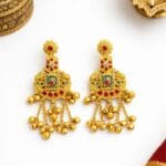 Rajasi Ratna temple earrings with red and green stones, antique gold finish and cascading ghungroo drops