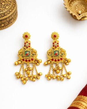 Rajasi Ratna temple earrings with red and green stones, antique gold finish and cascading ghungroo drops