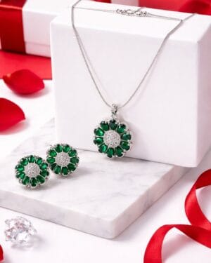 Sterling silver necklace set with emerald green American diamonds and matching stud earrings, elegant luxury jewelry