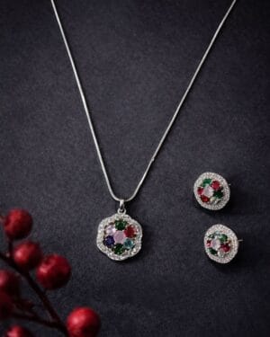 Luxury multicolour gemstone necklace set with matching stud earrings on dark background