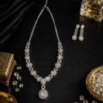 American diamond teardrop necklace and earrings set with adjustable chain, elegant AD jewellery for party and festive wear