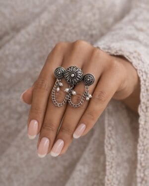 Oxidized multi finger chain ring with pearl charms on woman hand
