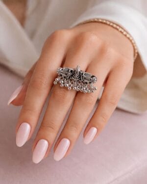Tirupati Balaji oxidized temple ring with ghungroo danglers on woman hand